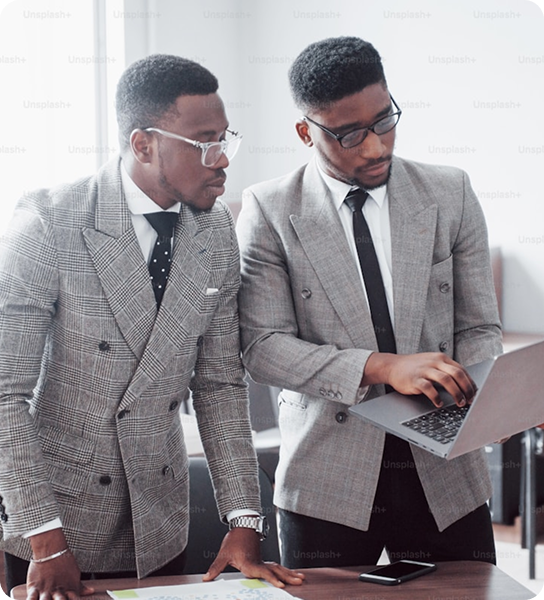 Two businessmen collaborating with laptop